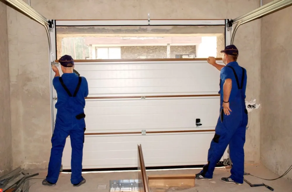 American Best Garage Doors technicians servicing a garage door in Philadelphia & South Jersey — American Best Garage Doors